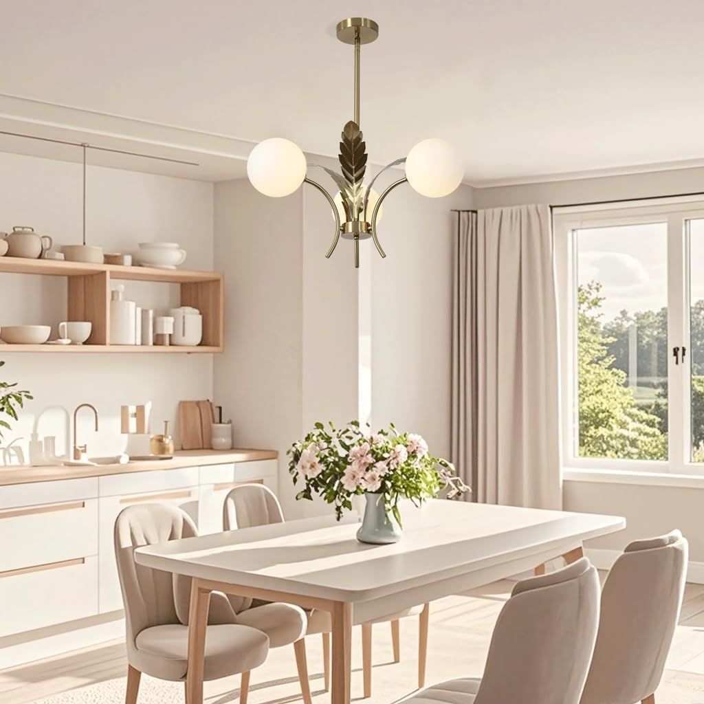 Modern kitchen with a dining table and chairs, featuring a chandelier and a window.
