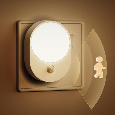 Warm white night light glowing in dark room

