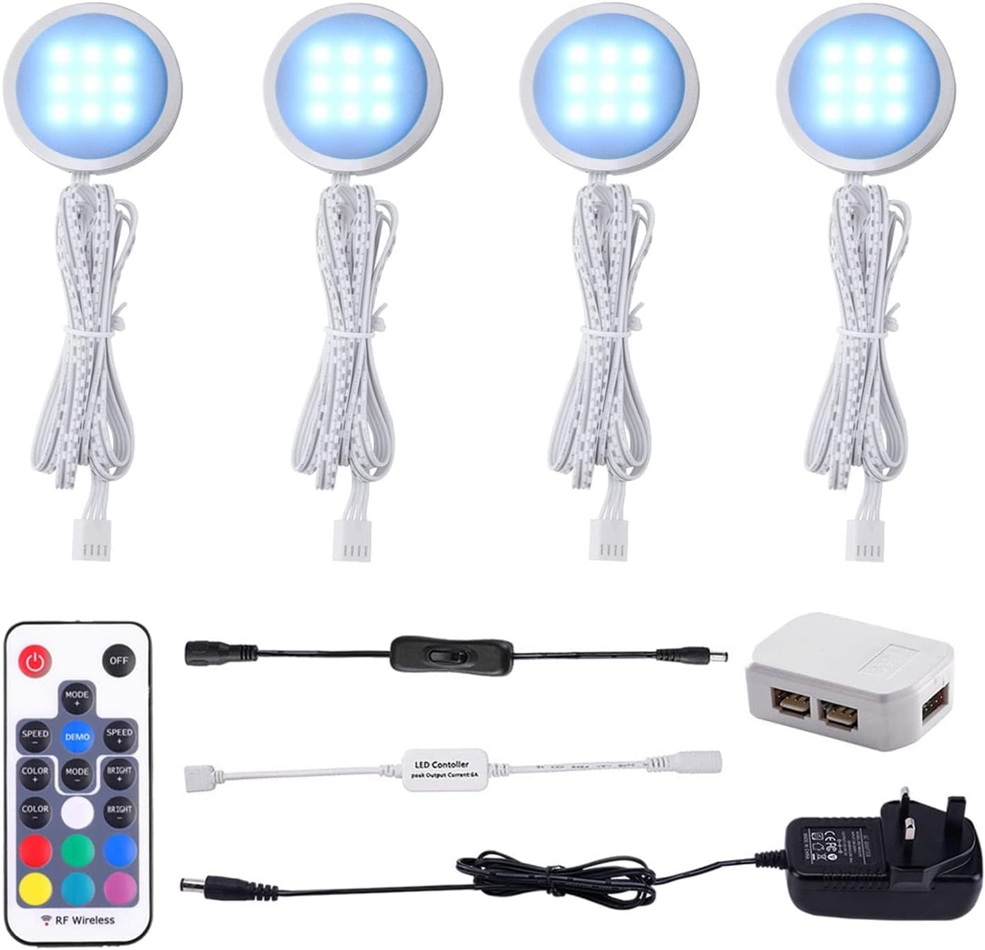 Set of LED lights with remote control and power adapter on a white background