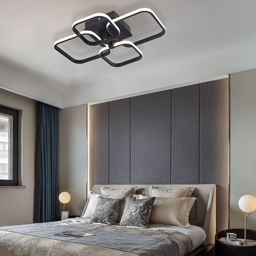 Modern bedroom with a stylish ceiling light fixture.