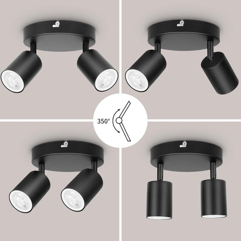 Black ceiling light fixture with adjustable head on a neutral background