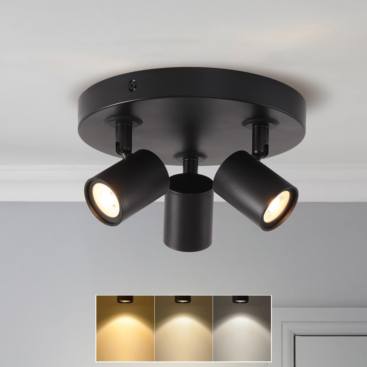 Black ceiling light fixture with three adjustable lights on a neutral background