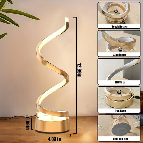 Gold spiral table lamp with detailed specifications on a wooden surface.
