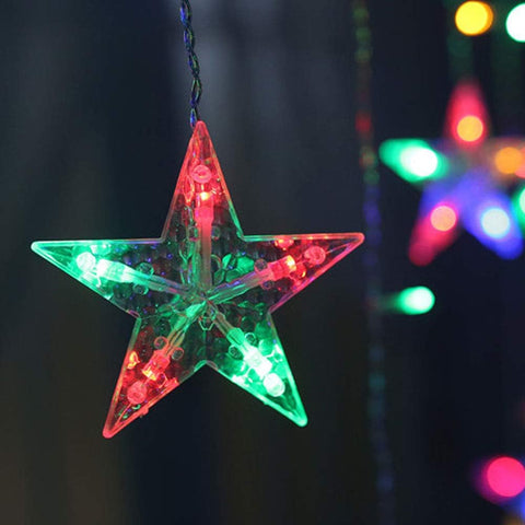 Star-shaped LED light ornament with multicolor lights on a dark background