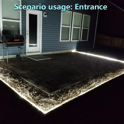 Neon lights on a driveway leading to a house entrance
