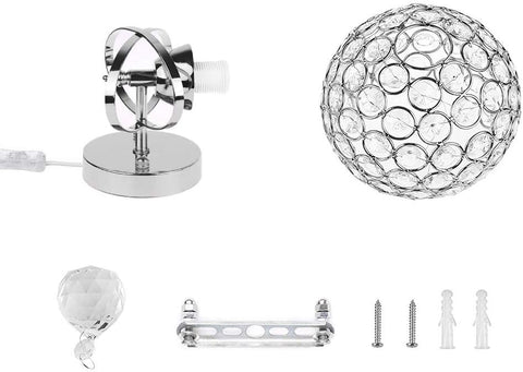 Set of decorative lamp parts including a crystal ball, metal bracket, and screws on a white background.