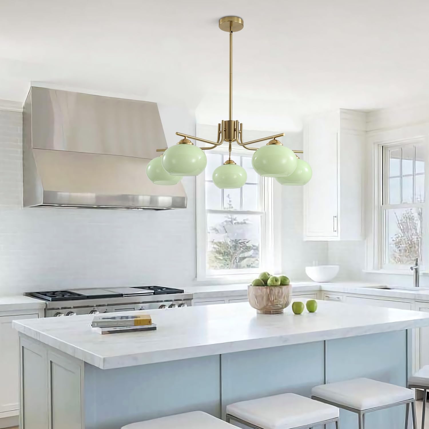 Modern kitchen with a pendant light fixture, stove, and island.