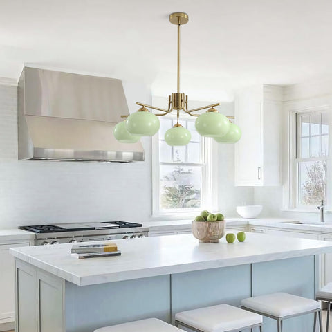 Modern kitchen with a pendant light fixture, stove, and island.