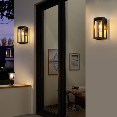 Modern wall lights on a neutral wall with a mirror and decor items.