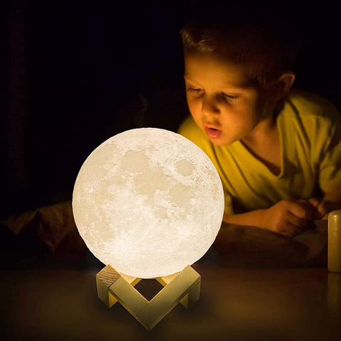 Different size options of the moon lamp displayed together.


