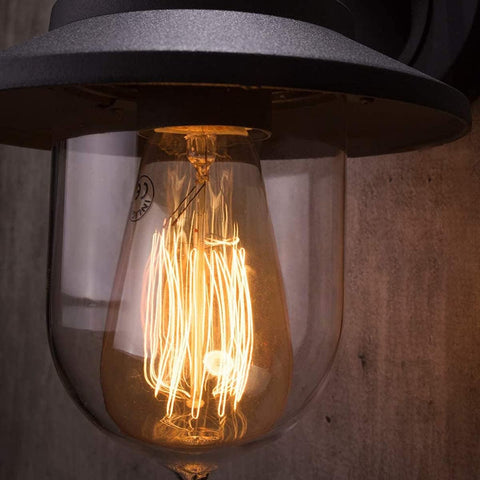 Vintage-style light bulb with exposed filaments inside a clear glass shade.