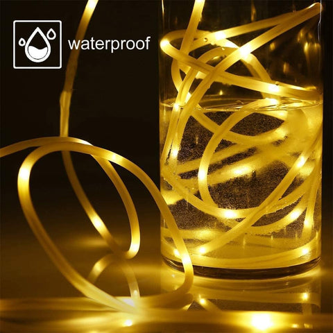 Gold LED strip light in a glass container with 'waterproof' label.
