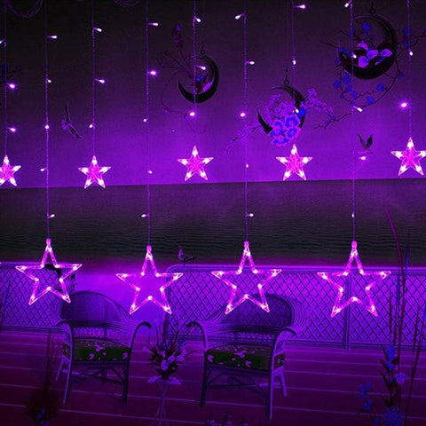 Purple star-shaped LED lights hanging against a dark background with decorative elements.