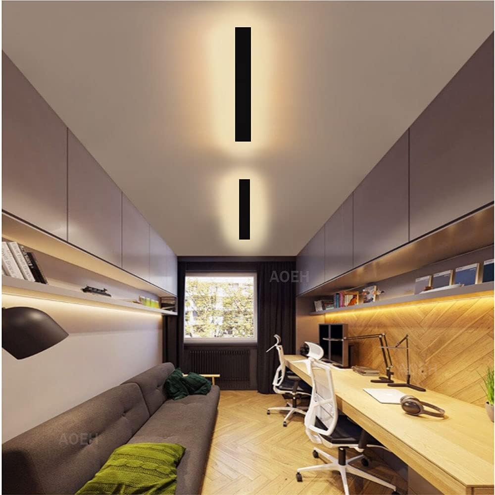 Modern office or home office with a desk, chairs, and wall-mounted lights.