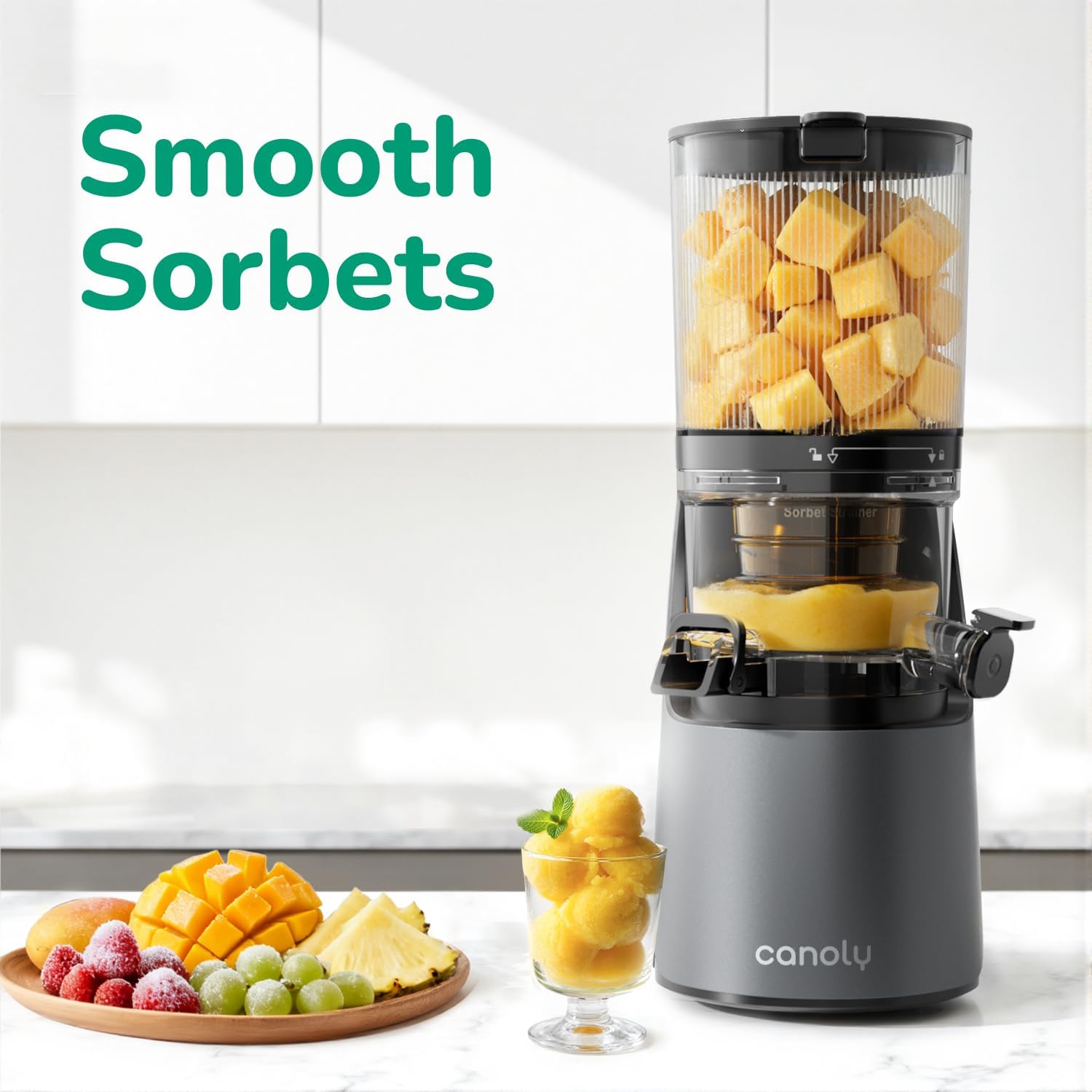 Juicer with fruits and sorbets on a kitchen counter, featuring the brand 'canoly'.
