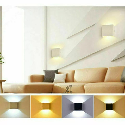 Alpha Lights wall sconce providing warm illumination in a bedroom

