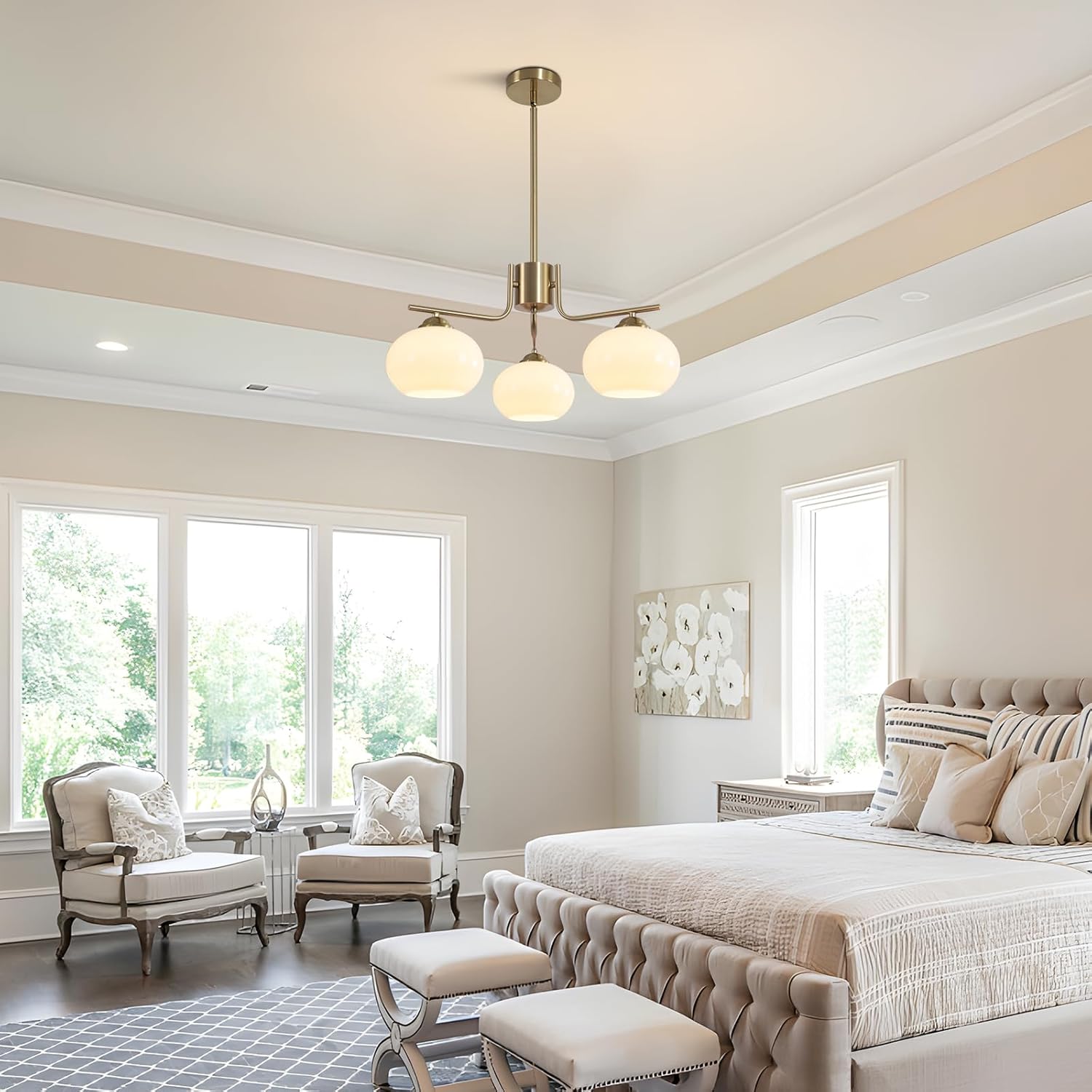 Neatly arranged bedroom with a bed, chairs, and decorative elements.