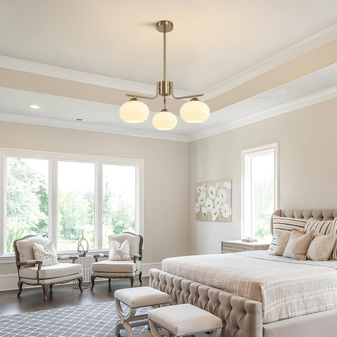 Neatly arranged bedroom with a bed, chairs, and decorative elements.