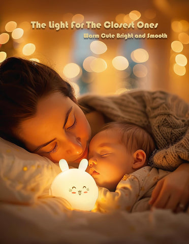 Woman and child lying down with a glowing night light, surrounded by warm bokeh lights.