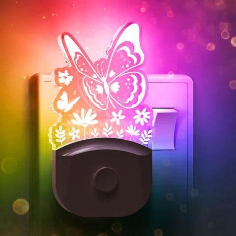 LED butterfly night light glowing with warm white light

