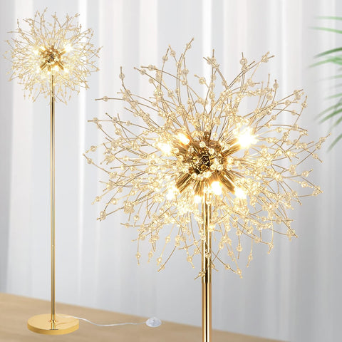 Gold decorative floor lamp with starburst design against a white curtain background