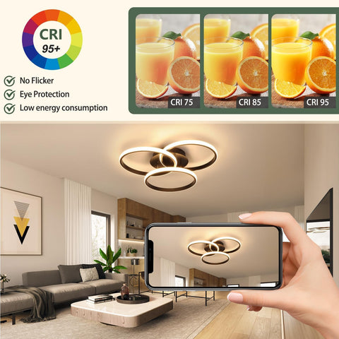 Modern living room with a ceiling light fixture, smartphone displaying a room view, and a product image of oranges and glasses.