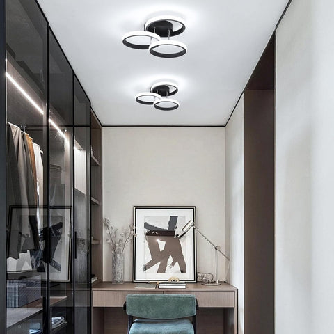 Modern interior of a room with a desk, chair, and wall art.