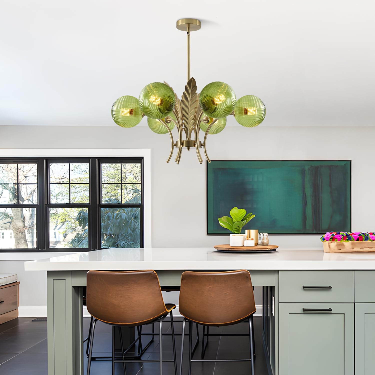 Modern kitchen with green chandelier, white island, and brown chairs.