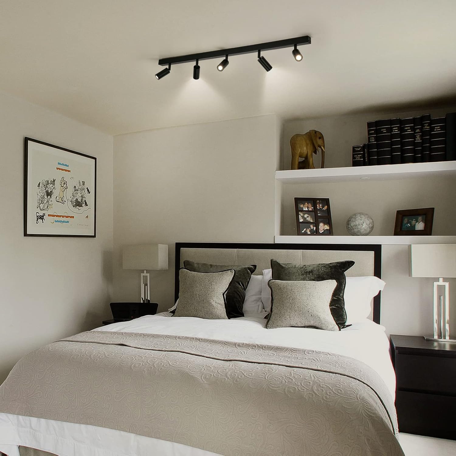 Modern bedroom with a bed, nightstands, and wall art.
