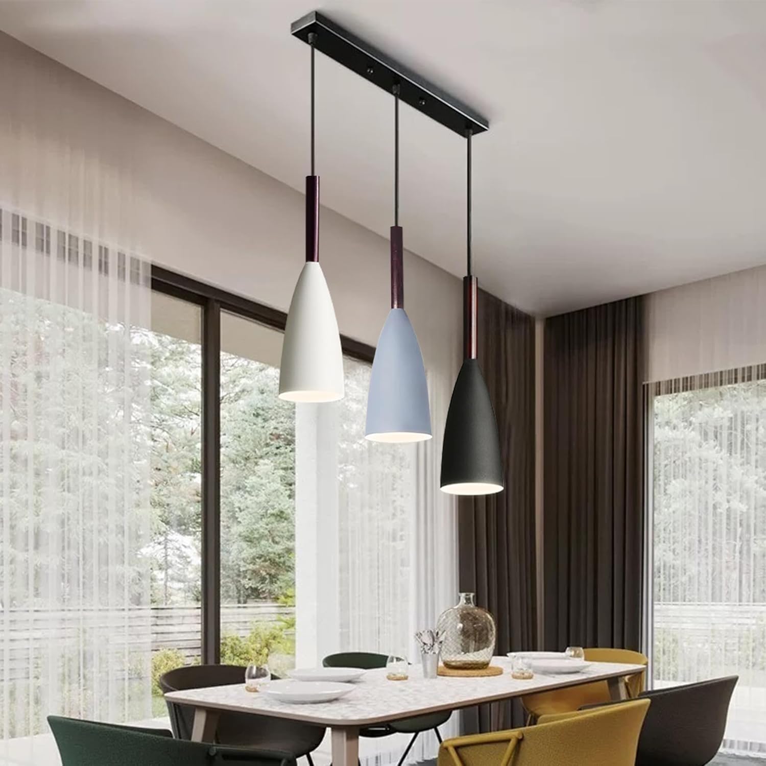 Modern dining room with pendant lights and large windows.