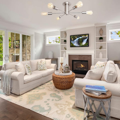 Modern living room with beige sofas, a fireplace, and a television.