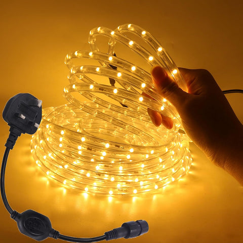 Coiled LED rope light with plug on a yellow background
