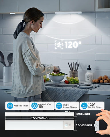 Woman preparing food in a kitchen with a motion sensor light above her head.