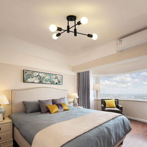 Modern bedroom with a bed, lamp, and window view