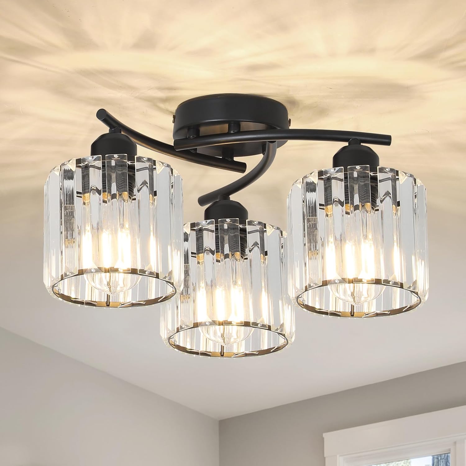 Ceiling light fixture with three glass lampshades on a ceiling