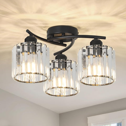 Ceiling light fixture with three glass lampshades on a ceiling