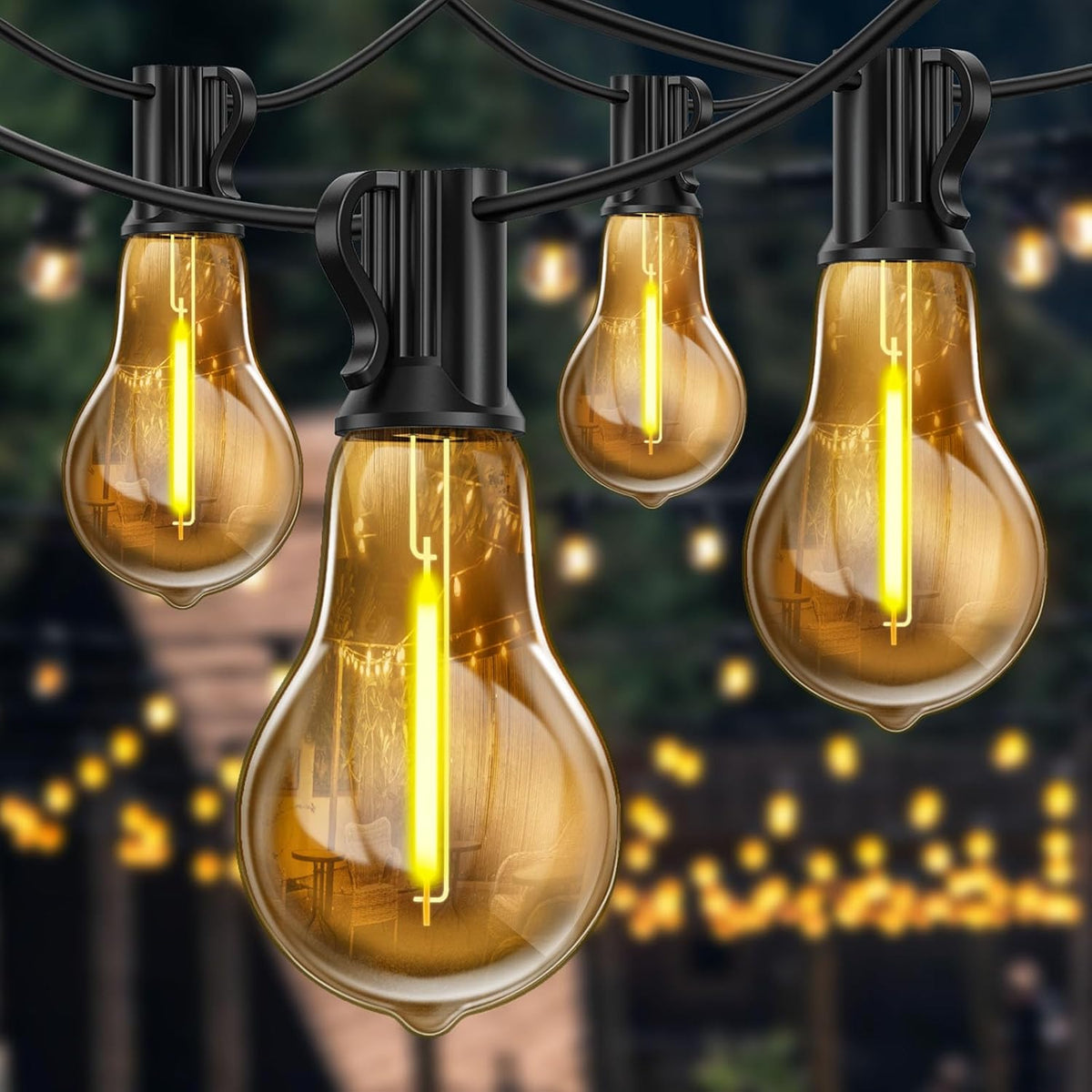 String of illuminated vintage-style light bulbs against a blurred outdoor background