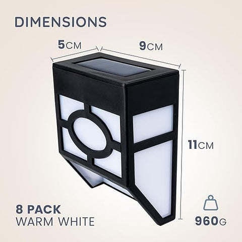 Bright LED solar wall light illuminating a garden pathway

