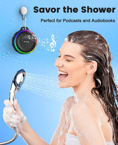 Person showering with a handheld showerhead and a showerhead speaker labeled 'Savor the Shower' on a blue background.