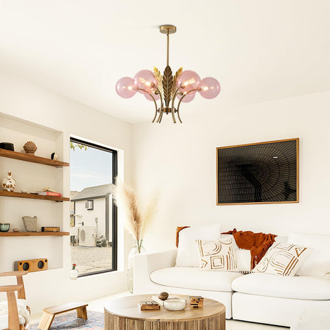 Modern living room with a chandelier, sofa, and wall art.