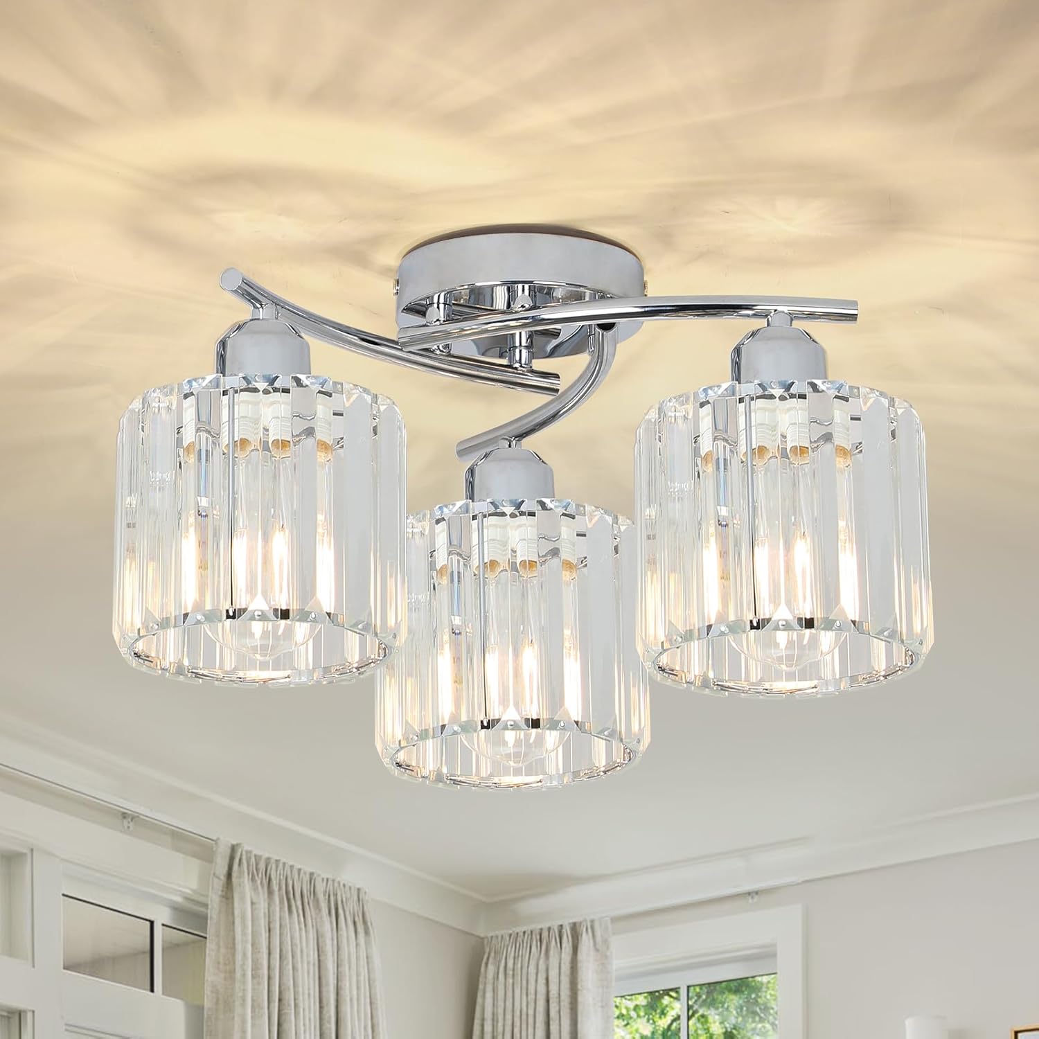 Ceiling light fixture with three crystal lampshades in a room setting