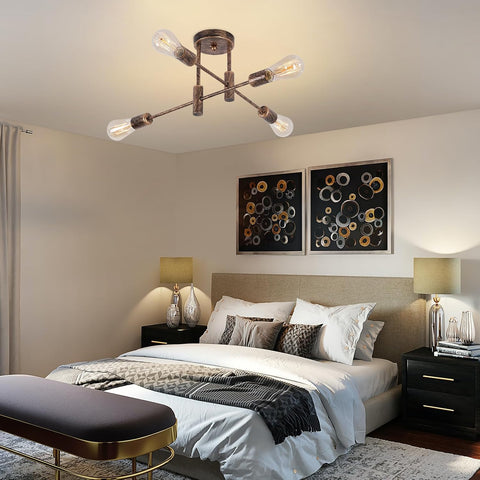 Modern bedroom with a ceiling light fixture, bed, and wall art.