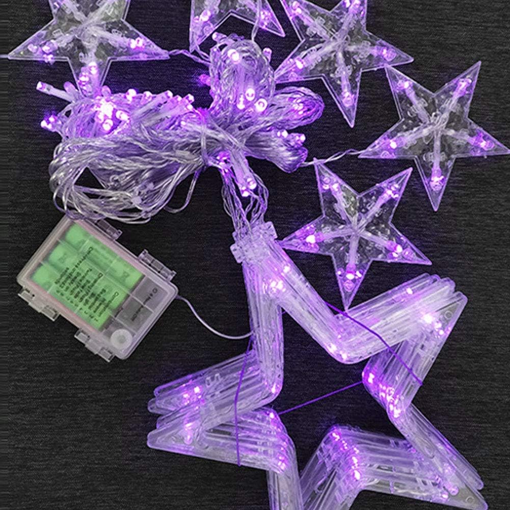 Star-shaped LED string lights with a battery pack on a dark background