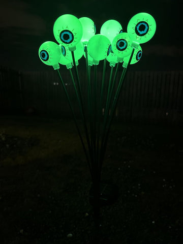 Solar Powered Halloween Eyeball Garden Lights, 12-Piece Green LED Stake Set, IP65 Waterproof Outdoor Lawn and Pathway Decorations.