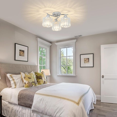 Neatly made bed in a bedroom with a ceiling light fixture.