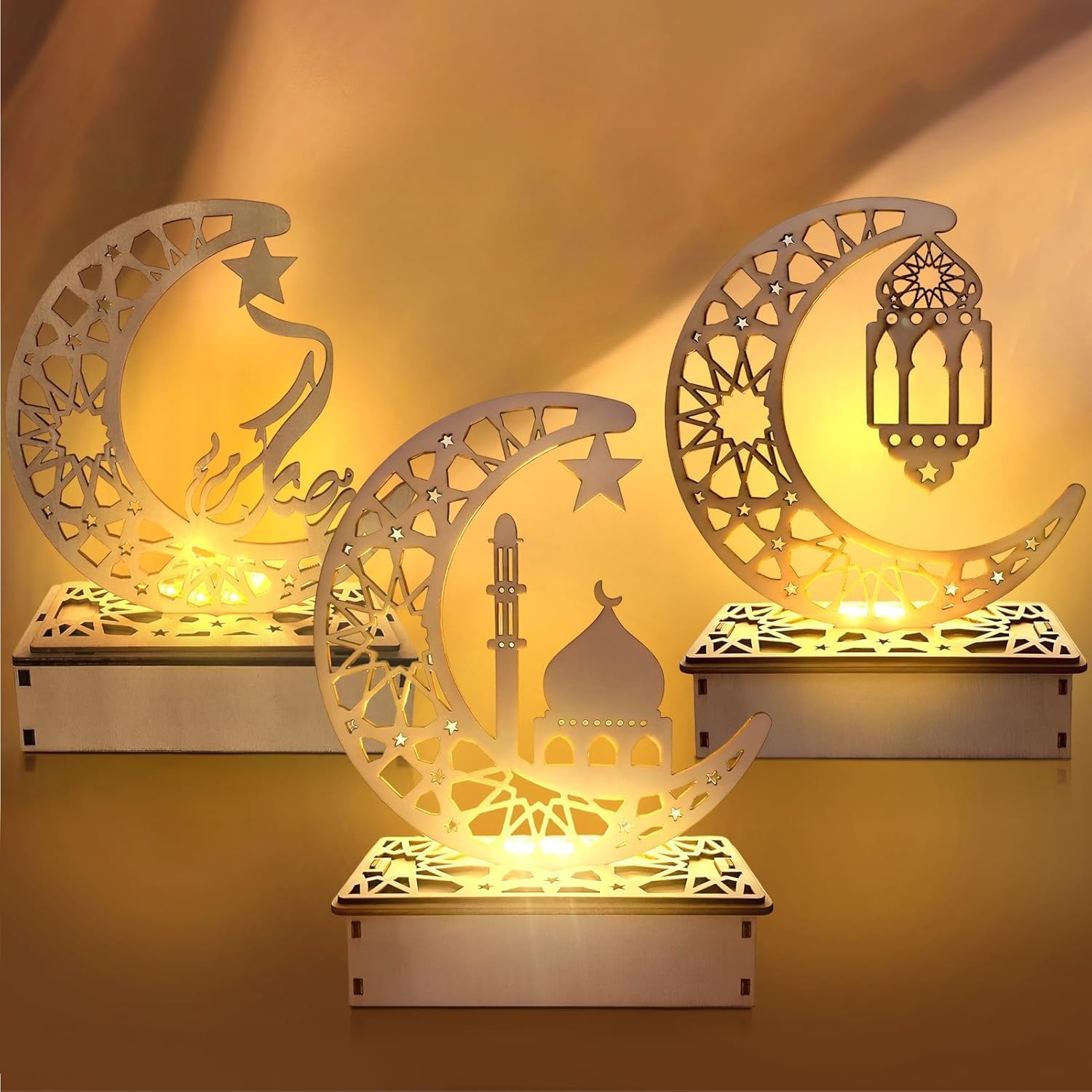 Decorative moon and star lights with intricate designs on a yellow background