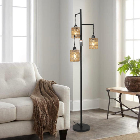 Floor lamp with multiple lampshades in a living room setting.
