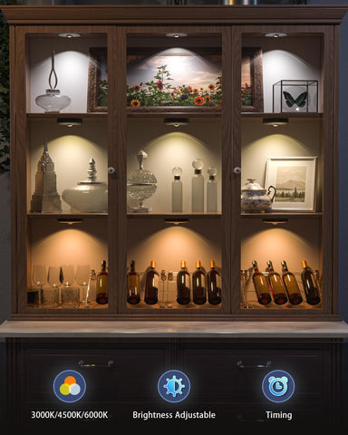 Wooden cabinet with glass shelves displaying various items, with control icons for light settings at the bottom.