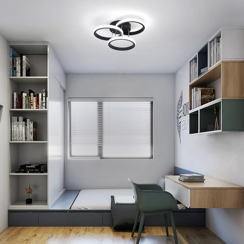 Modern bedroom with study area, bookshelves, and ceiling light fixture.