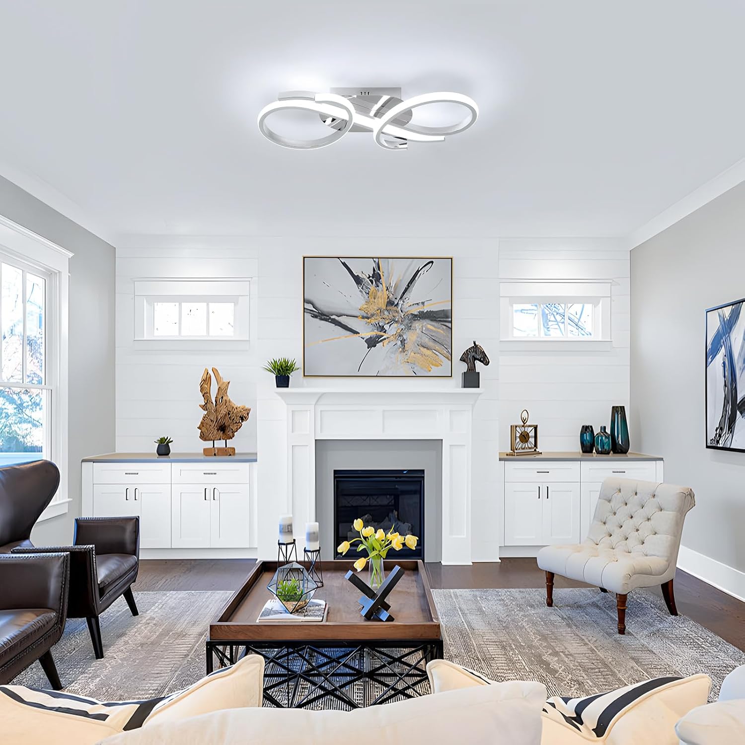 Modern living room with a fireplace, coffee table, and decorative items.